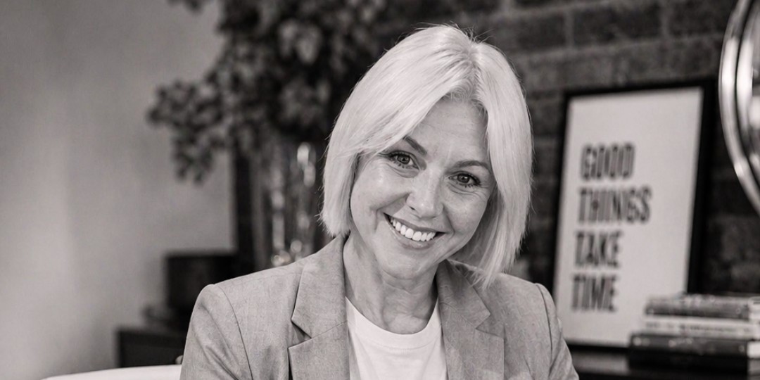 A neurodivergent business owner smiling at her laptop while deciding between AI assistants for her ADHD brain
